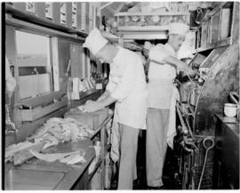 
Chefs at work in the train galley.
