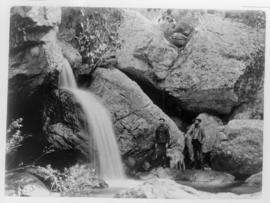 G Boeschoten in uniform and another man at waterfall.