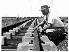 Inspection of railway track on segmented concrete sleepers.