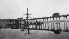 Wilderness, circa 1926. Wilderness bridge construction: Pile No 9 bent during screwing. (Collecti...