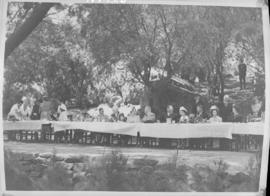 Paarl, 20 February 1947. Royal party with others at very long picnic table.