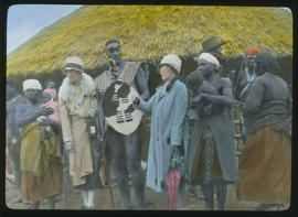 Two white women with Zulu warrior.