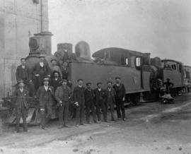 Railwaymen posing with a pair of CSAR Class E later SAR Class H1.