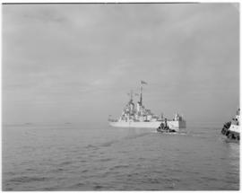Cape Town, 24 April 1947. SAR tugs assisting 'HMS Vanguard' sailing away at conclusion of tour.