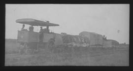 Dutton roadrail tractor with goods wagons.