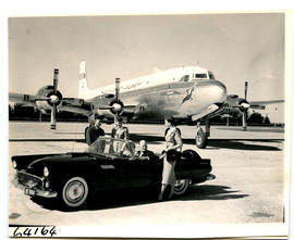 Port Elizabeth, 1955. SAA Douglas DC-7B ZS-DKD 'Dromedaris' with Ford Thunderbird.