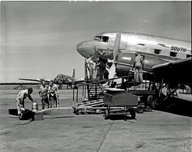 Johannesburg, 1948. Palmietfontein airport. SAA Douglas DC-3 ZS-AVJ working on propellers. In the...