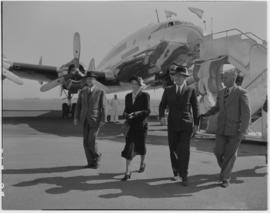 Johannesburg, August 1950. Palmietfontein Airport. Four people walking away from SAA Lockheed Con...