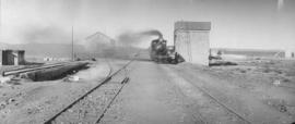 Hanover Road, 1895. Cape 6th Class, later SAR Class 6 locomotive at water tank. (EH Short)