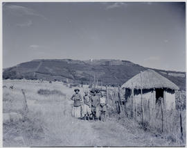 Stutterheim district, 1948. Four women next to hut.