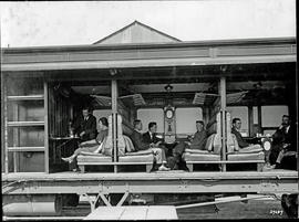 "Passenger car with side removed to show compartment scenes."