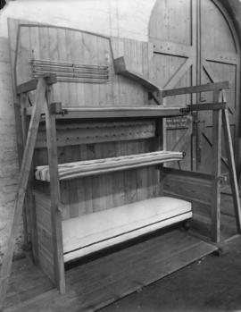 Mockup of NGR triple sleeping bunk, beds folded down.