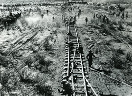 Upington district, 1914/15. Platelaying for the Prieska-Kalkfontein line, viewed from the illumin...