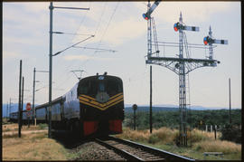 De Aar, March 1986. SAR Class 7E No E7027 with Algoa passenger train. [T Robberts]