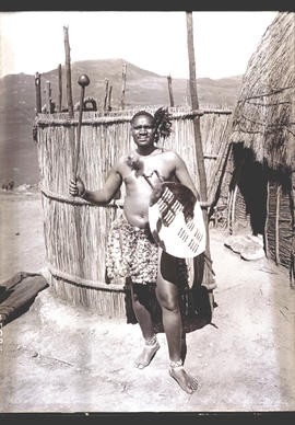 Zululand, 1933. Chief Langalake next to hut.