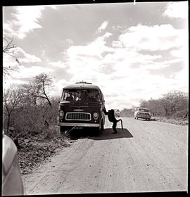 Kruger National Park, 1962. SAR Chevrolet motor coach No MT6919 surrounded by baboons.
