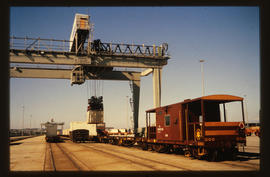Cape Town, 1983. Overhead crane loading containers with SAR type VL-9 good guard's van on the right.