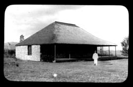 Round in Nine Tours - house with thatched roof.