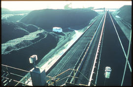 Richards Bay, November 1979. Coal stockpiles and conveyor belts at Richards Bay harbour. [De Waal...