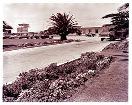 Port Elizabeth, 1963. HF Verwoerd airport. SAA Bedford bus at terminal building car park.