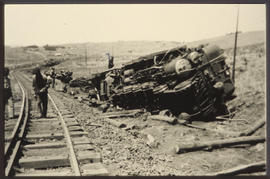Derailed and overturned steam locomotive.