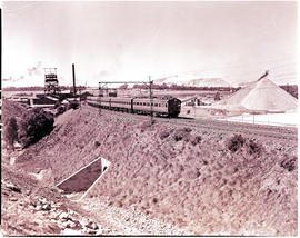 Johannesburg, 1939. Suburban train passing mine dump.