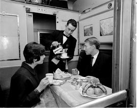 July 1965. Dinner served in train compartment.