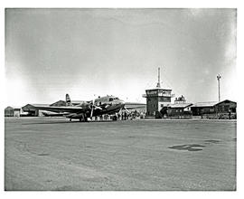 Johannesburg, 1949. Palmietfontein airport. View of control tower from apron, with SAA Vickers Vi...