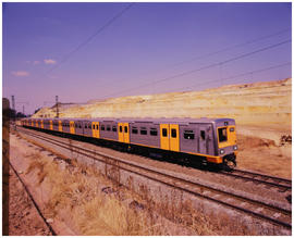 Johannesburg. Metroblitz suburban train on bridge.