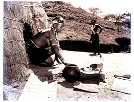 Natal, 1951. Zulu woman in doorway of hut.