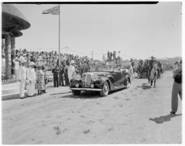 Maseru, Basutoland, 12 March 1947. King George VI and Queen Elizabeth in open car arrive at indab...
