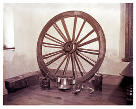 Paarl, 1952. Interior of Huguenot museum, wagon wheel.
