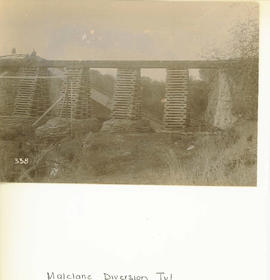 Malelane, circa 1900. Railway line being supported by birdcaging after damage during the Anglo-Bo...