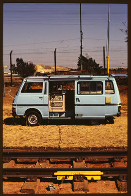 Vehicle with electronic equipment at railway track monitoring setup. Nissan E20.