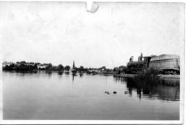 Upington, 1923. Orange River flood damage. Pumping water.