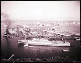 Durban. 'Pendennis Castle' of the Union-Castle Line entering Durban Harbour with tug.