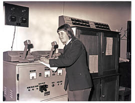 Johannesburg, 1975. Jan Smuts airport. SAR Police officer in security control room.