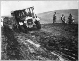 Circa 1926. Thornycroft three-axle all rigid bus struggling through mud.