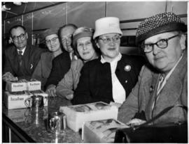 Johannesburg, September 1957. Group of dignitaries in a self-service diner of a cafeteria special...