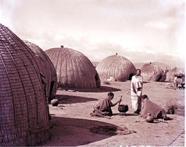 "Zululand, 1956. Preparing food at traditional huts."