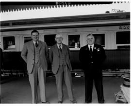 Rhodesia, April 1947. Three officials in front of Rhodesian Pilot Train.