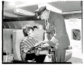 
SAA Boeing 707 interior. Pilot and passenger.
