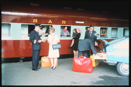 Johannesburg, 1977. Passengers arriving at mainline train from Park Station to Cape Town. [Ria Li...