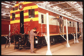 Pretoria. Repainting railway coach at Koedoespoort.