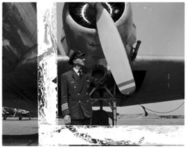 October 1963. Captain Blackbeard standing next to propeller in front of SAA Douglas DC-3 ZS-DJX '...