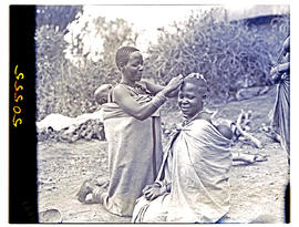 Northern Transvaal, 1946. Bavenda women hairdressing.