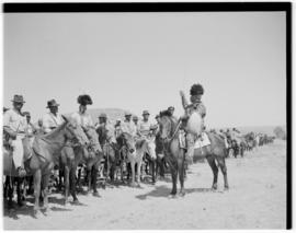 Basutoland, 12 March 1947. Tribal leader on horseback keeping other mounted people dressed in wes...