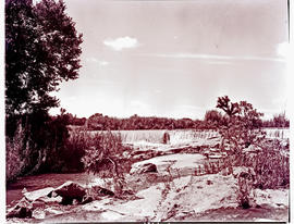 "Nelspruit district, 1946. Water overflowing weir in the Crocodile River."