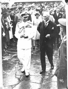 Pretoria, 29 March 1947. King George VI and Prime Minister JC Smuts walking past welcoming crowd ...