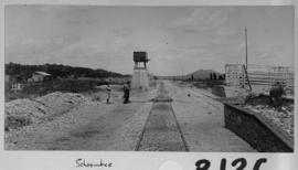 Schoombee, 1895. Unusual water tank and loading platform at station. (EH Short)